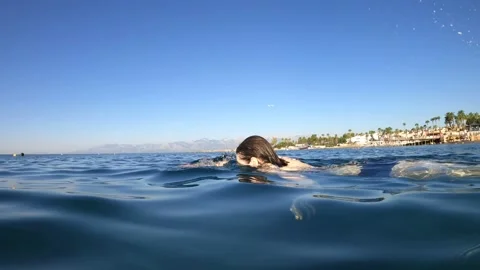 A lady floating on water Video stock 138340699