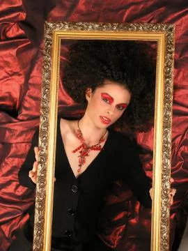 Lady with frame on red Stock Photos