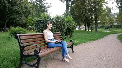 Lady freelancer working in park. Freelance benefits. Woman with laptop works Video stock 100628879