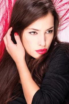 Lady in front of red feather Stock Photos
