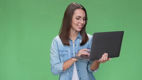 Lady geek use netbook type colleague review isolated green color background Video stock 166044354