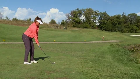 Lady Golfer hitting ball Stock Footage 74251982