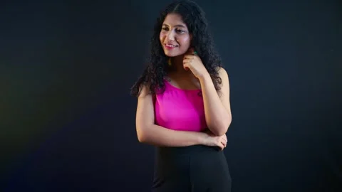 Lady grinning softly while recalling cherished moment Stock Footage 295520434