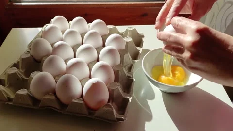 Lady hand cracking fresh egg on a bowl Stock Footage 158019929