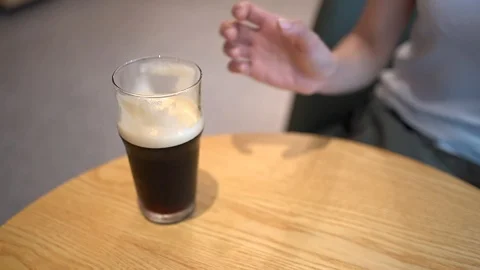 Lady hand lifting up the nitro cold brew coffee Stock Footage 126044770