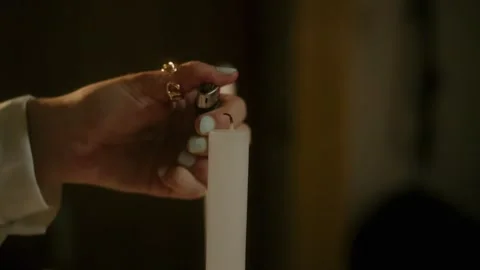 Lady hand lighting candle close up Stock Footage 339843207