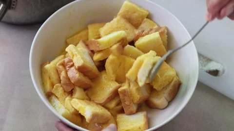 Lady hand mixxing bread with egg on a white bowl Stock-Footage 254100538