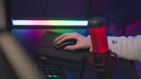 Lady hand using mouse in fluffy sweater under subtle ambient lighting Stock Footage 307458862