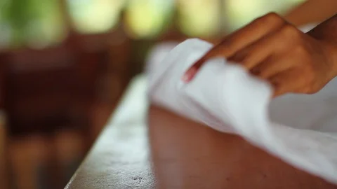 Lady hands making a dinning table  with white cloth Stock Footage 94135862