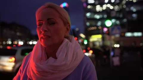 Lady in her 50 suffering from strong headache on background of night city 스톡 동영상 119024507