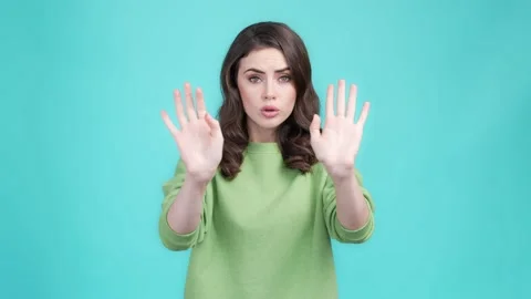 Lady hold hand warn no way against isolated aquamarine color background Video stock 169943211