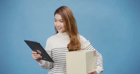 Lady hold package parcel box and digital tablet enjoy online shopping. Stock Footage 172524594