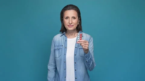 Lady hold tablet medic make thumb-up choice isolated blue color background Stock Footage 167319446