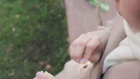 Lady holds written message. Lady in tranquil park with note and gentle rose. An Stock Footage 332618463