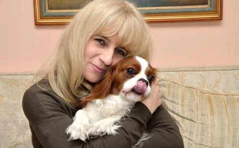 Lady Hugging Cavalier Stock Photos
