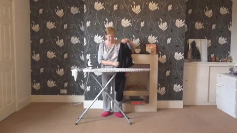 Lady irons pant Stock Footage 87739423