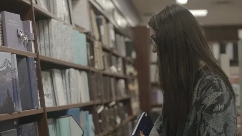 Lady In Library Slow Motion Stock Footage 83603789