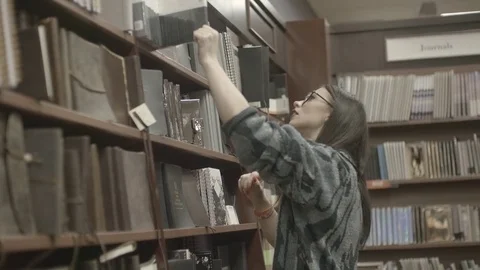 Lady In Library Slow Motion Stock Footage 83603807