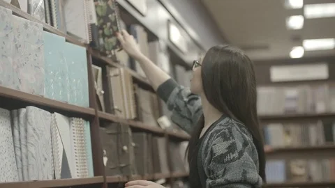 Lady In Library Slow Motion Stock Footage