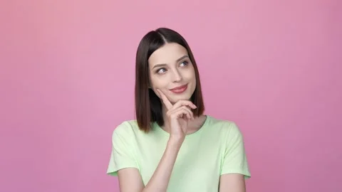 Lady look copyspace decide intelligent thoughts isolated pink color background Video stock 166457125