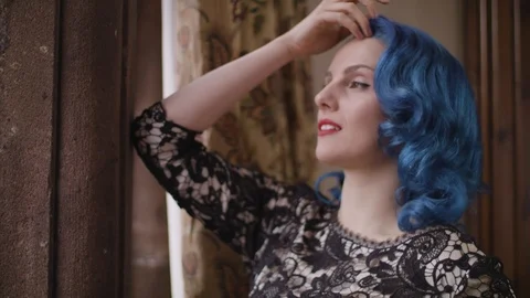 Lady looking out of the window Stock Footage 109488381