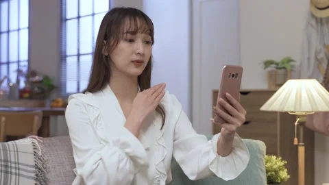 Lady looking at phone screen with concentration Stock-Footage 154028580