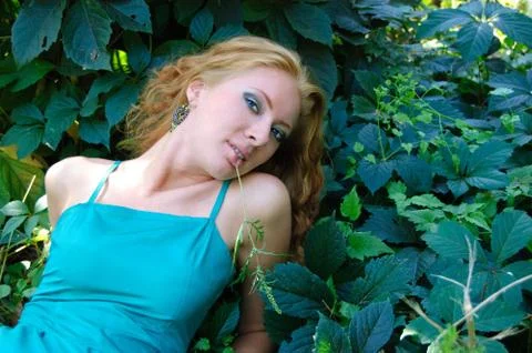 Lady lying on grass Foto stock