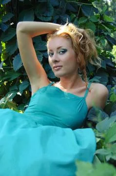Lady lying on grass Stock Photos