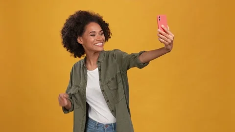 Lady make selfie gadget send blog followers isolated mustard color background Video stock 166161887