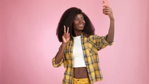 Lady make selfie gadget show v sign blow kiss isolated pink color background Stock Footage 166046906