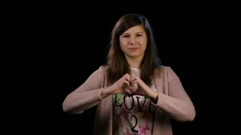 A Lady Making a Heart Gesture Stock Footage 86588626