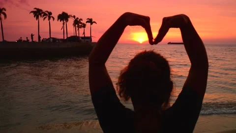 Lady making heart shape with hands at sunset thailand Stock Footage 229255208