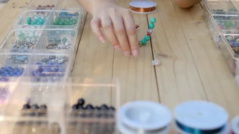 Lady making turquoise necklace Video stock 100793657