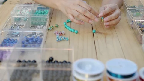 Lady making turquoise necklace Video stock 100796853