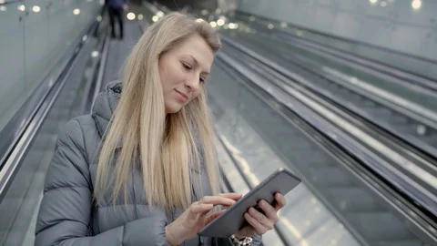 Lady in metro with tablet	 Stock Footage