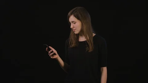 A Lady Mimicing Against a Black Background Stock Footage 87160122