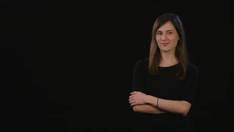 A Lady Mimicing Against a Black Background Stock Footage 87161077