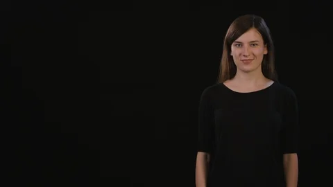 A Lady Mimicing Against a Black Background Stock Footage 87166142