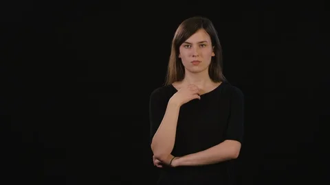 A Lady Mimicing Against a Black Background Stock Footage 87166674