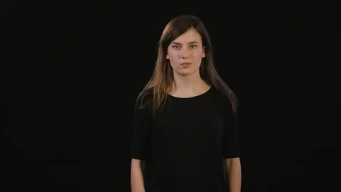 A Lady Mimicing Against a Black Background Stock Footage 87173600