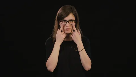 A Lady Mimicing Against a Black Background Stock Footage 87181714