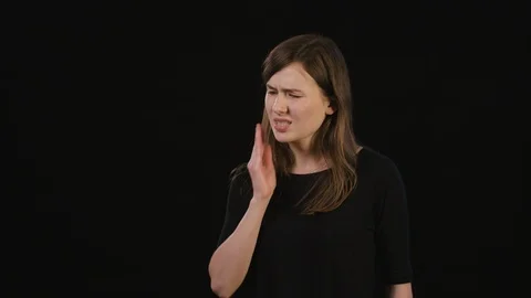 A Lady Mimicing Against a Black Background Stock Footage 87183817