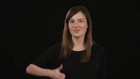 A Lady Mimicing Against a Black Background Stock Footage 87185533