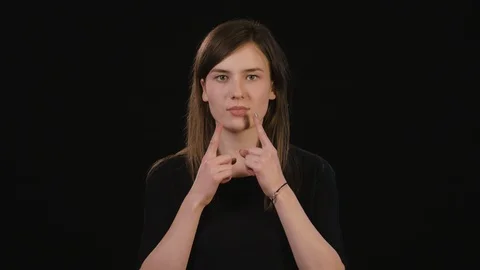 A Lady Mimicing Against a Black Background Stock Footage 87185929