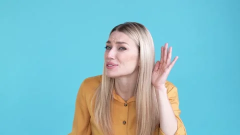 Lady not hear difficulty secret disappointed isolated blue color background Stock Footage 170773556