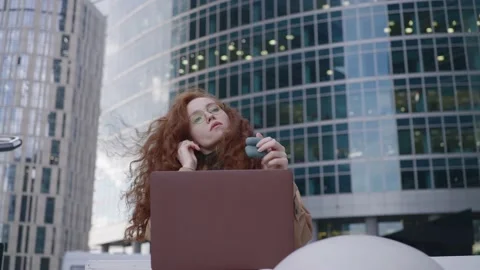 Lady opens laptop and puts headphones working after hours Stock Footage 163760837