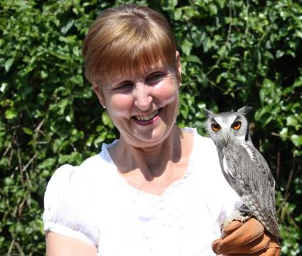 A lady with an owl Stock Photos