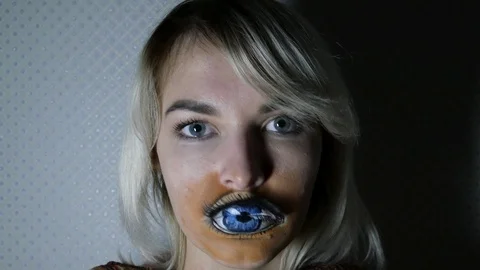 Lady with painted eye on lips Stock Footage 98707317