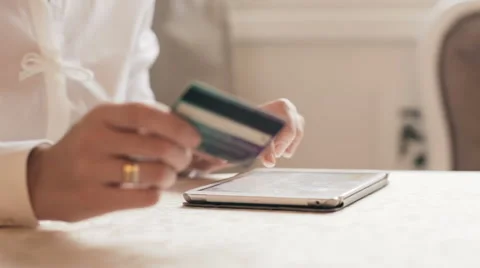 Lady paying bills using credit/debit card on touchpad Stock Footage 58321084