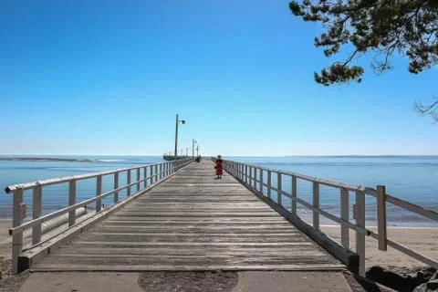 Lady on the pier Stock Photos